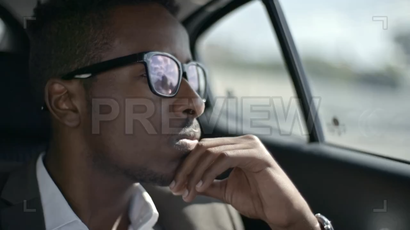 Businessman Looking Through Car Window